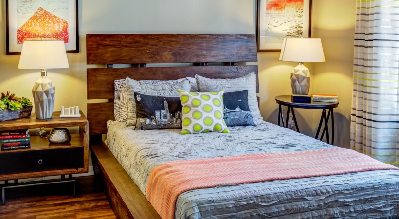 Make this space your own a bed with a night stand on each side