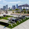 a rooftop lounge area over looking a city skyline