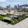 a patio with chairs and tables and a city skyline in the background