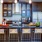 a kitchen with a bar and stools