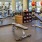 a room with exercise equipment and chairs